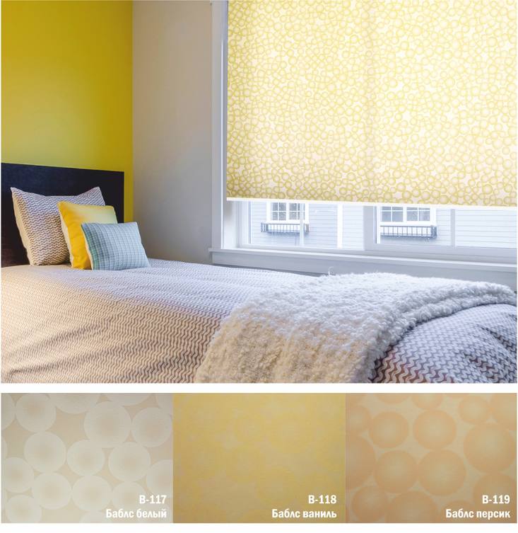 Желтые рулонные шторы с рисунком в спальне